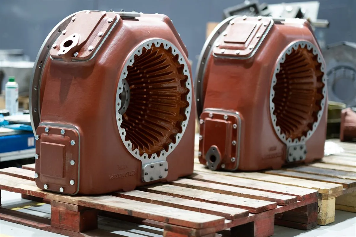 Two primed turbocharger casings on a pallet, ready for shipment