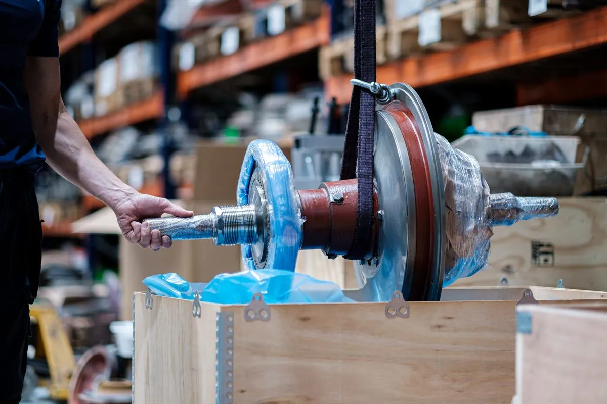 Wrapped ABB VTR304 rotor being placed in a plywood export crate