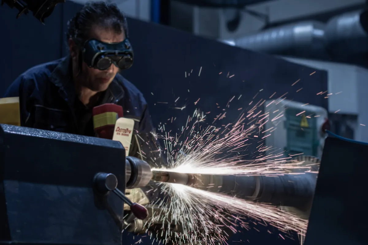 Metal spraying a VTR354 turbocharger shaft in the workshop