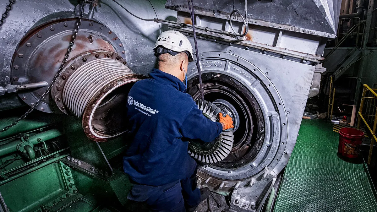 Turbo Internacional engineer servicing a MAN TCA66 turbocharger on board