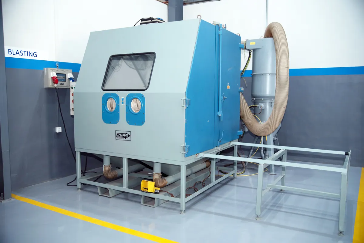 Blasting cabinet with its extraction unit at the Karachi workshop