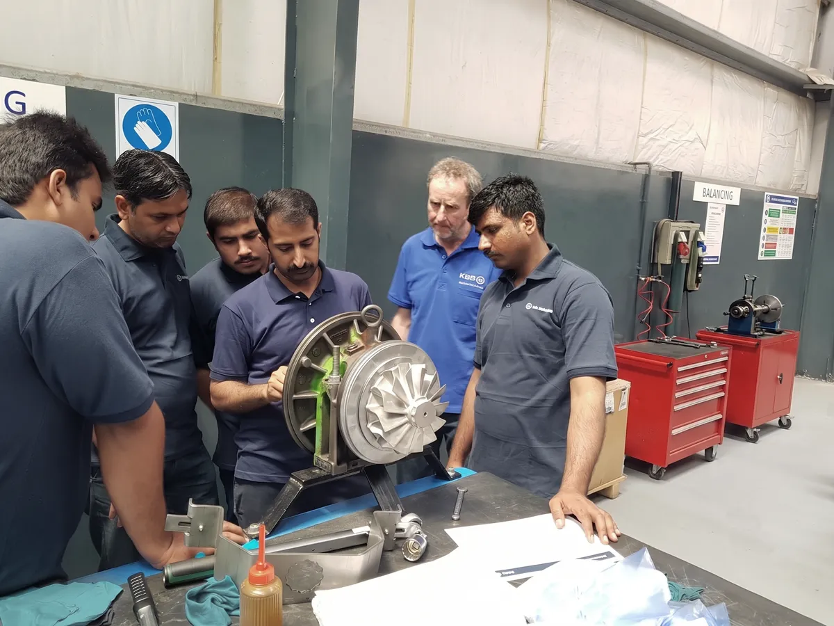KBB training session around a turbocharger rotor at the Lahore workshop