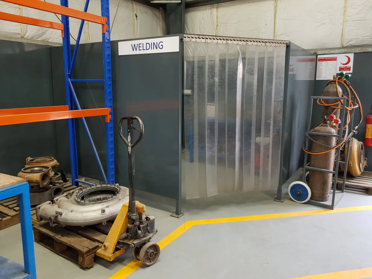 Welding area behind its screen at the Lahore workshop