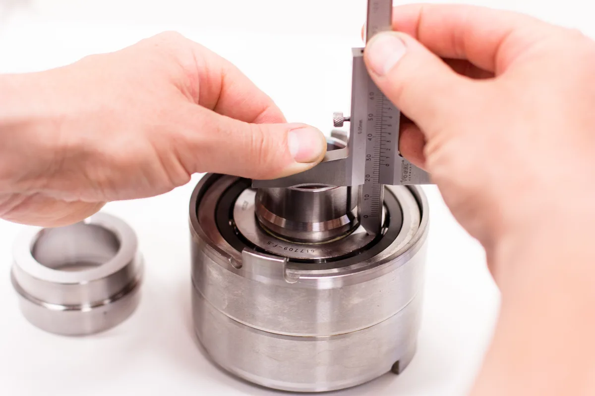 Height of an assembled bearing pack being checked with a vernier caliper