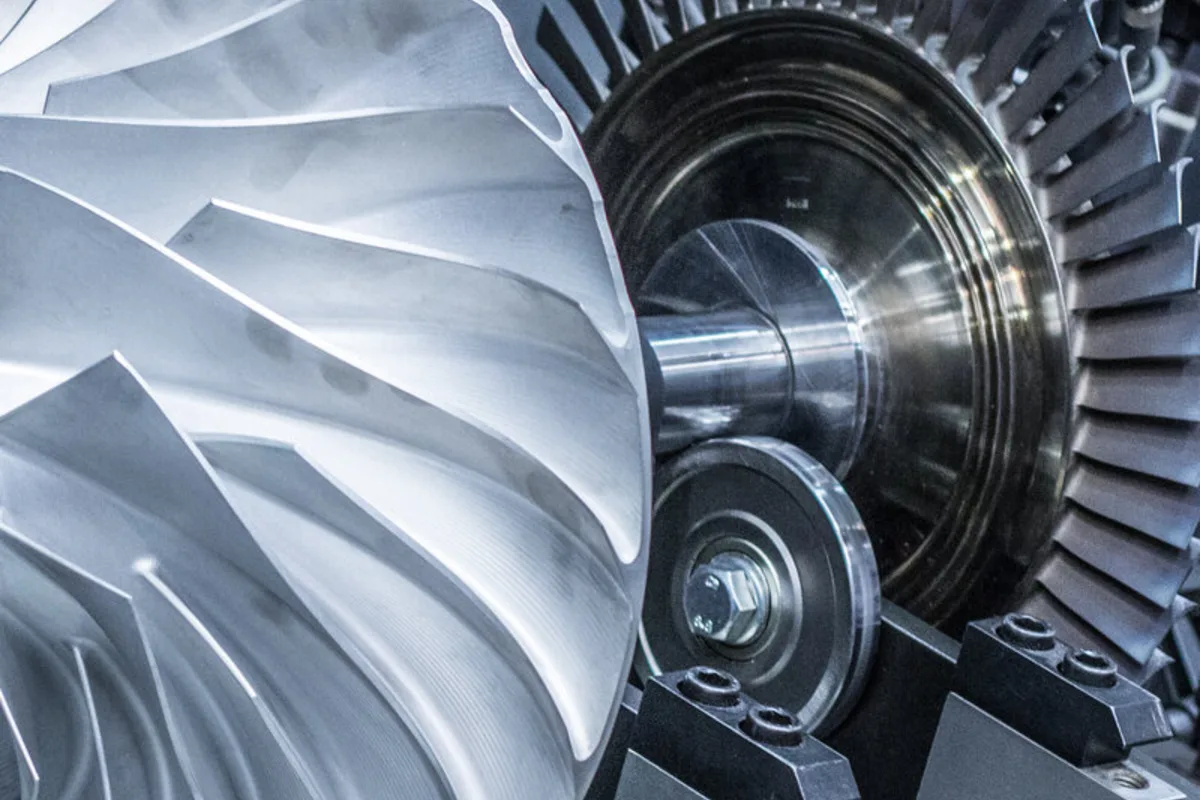Compressor and turbine wheels of a rotor set up for balancing